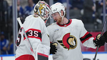 Apr 29, 2025; Toronto, Ontario, CAN; Ottawa Senators defenseman Jake Sanderson (85) celebrates with goaltender Linus Ullmark (35) after defeating the Toronto Maple Leafs during game five of the first round of the 2025 Stanley Cup Playoffs at Scotiabank Arena. Mandatory Credit: Nick Turchiaro-Imagn Images