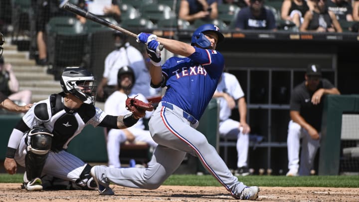 Aug 29, 2024; Chicago, Illinois, USA;  Texas Rangers shortstop Corey Seager (5) hits a solo home run against the Chicago White Sox during the fourth inning at Guaranteed Rate Field. Mandatory Credit: Matt Marton-USA TODAY Sports