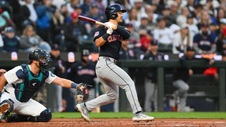 Apr 1, 2024; Seattle, Washington, USA; Cleveland Guardians left fielder Steven Kwan (38) hits a forced-out RBI against the Seattle Mariners during the third inning at T-Mobile Park. Mandatory Credit: Steven Bisig-USA TODAY Sports