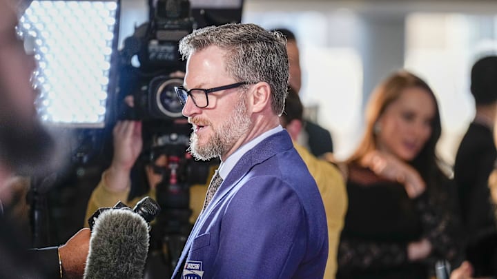 Jan 19, 2024; Charlotte, NC, USA; Dale Earnhardt Jr. talks to interviewers during a red carpet.