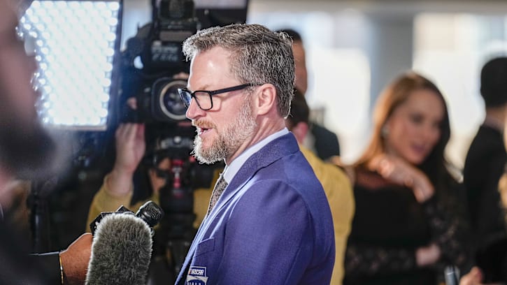 Jan 19, 2024; Charlotte, NC, USA; Dale Earnhardt Jr. talks to interviewers during a red carpet.