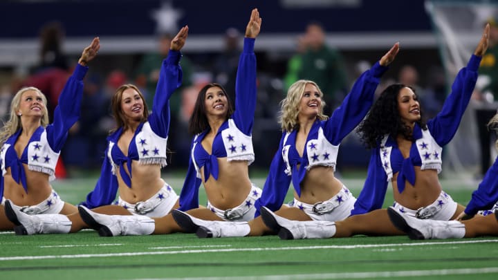 The Dallas Cowboys cheerleaders perform in a 2024 NFC wild card game against the Green Bay Packers at AT&T Stadium. 