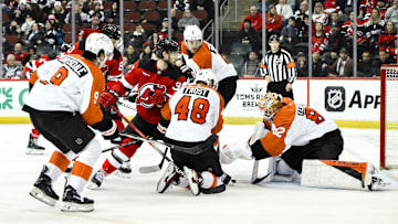 Jan 29, 2025; Newark, New Jersey, USA; Philadelphia Flyers goaltender Ivan Fedotov (82) makes a save against the New Jersey Devils during the third period at Prudential Center. Mandatory Credit: John Jones-Imagn Images