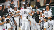 Vanderbilt infielder Mike Mancini (5) celebrates with Vanderbilt utility RJ Austin (42) after hitting a home run during a NCAA baseball game between the Tennessee Volunteers and Vanderbilt Commodores at Lindsey Nelson Stadium on May 11, 2025. Vanderbilt won 7-5 against Tennessee.