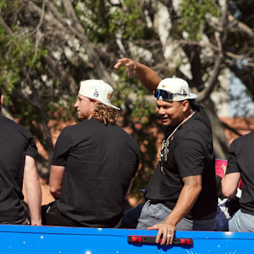 Dodgers pitcher Brusdar Graterol (48) celebrates with teammates on the bus during the 2024 World Series championship parade near Los Angeles City Hall on Nov. 1, 2024.