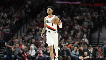 Feb 23, 2024; Portland, Oregon, USA; Portland Trail Blazers shooting guard Anfernee Simons (1) brings the ball up court during the first half Denver Nuggets at Moda Center. Mandatory Credit: Soobum Im-USA TODAY Sports