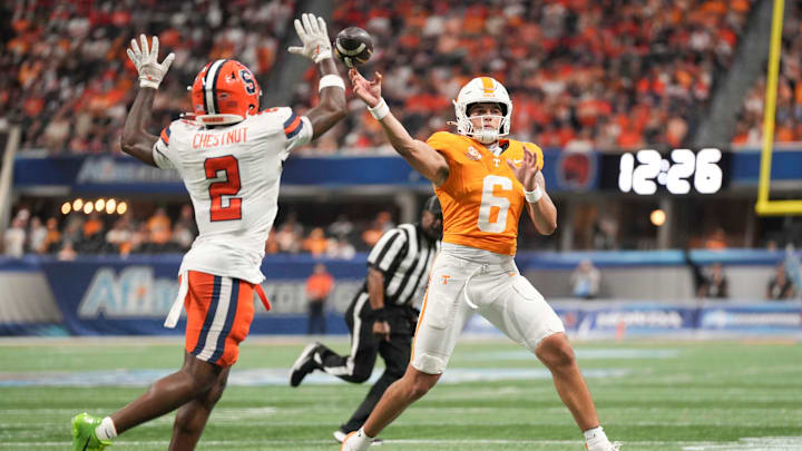 Tennessee quarterback Joey Aguilar (6) throws the ball as Syracuse defensive back Duce Chestnut (2) defends during the Aflac Kickoff Game between the Volunteers and Syracuse held at Mercedes-Benz Stadium in Atlanta, Ga., on August 30, 2025.