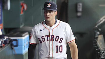 Houston Astros infielder Shay Whitcomb (10) walks in the dugout 