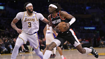 Dec 8, 2024; Los Angeles, California, USA;  Portland Trail Blazers forward Jerami Grant (9) drives past Los Angeles Lakers forward Anthony Davis (3) in the first half at Crypto.com Arena. Mandatory Credit: Jayne Kamin-Oncea-Imagn Images