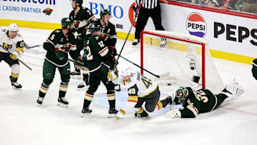 Apr 26, 2025; Saint Paul, Minnesota, USA; Vegas Golden Knights center Ivan Barbashev (49) puts the puck past Minnesota Wild goaltender Filip Gustavsson (32) during 1st OT in game four of the first round of the 2025 Stanley Cup Playoffs at Xcel Energy Center. Vegas Golden Knights win 4-3. Mandatory Credit: Bruce Fedyck-Imagn Images