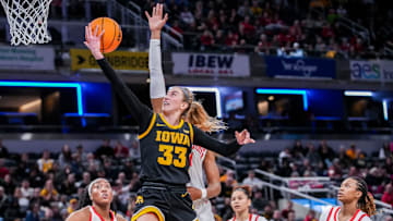 Iowa Hawkeyes guard Lucy Olsen (33) goes up for a basket Friday, March 7, 2025, in a quarterfinals game at the 2025 TIAA Big Ten Women's Basketball Tournament between the Iowa Hawkeyes and the Ohio State Buckeyes at Gainbridge Fieldhouse in Indianapolis. The Buckeyes defeated the Hawkeyes, 60-59.