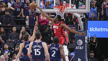 Apr 9, 2025; Inglewood, California, USA; Houston Rockets center N'Faly Dante (3) block Los Angeles Clippers guard Bogdan Bogdanovic (10) in the second half at Intuit Dome. Mandatory Credit: Kirby Lee-Imagn Images