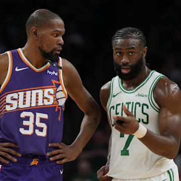 Mar 26, 2025; Phoenix, Arizona, USA; Phoenix Suns forward Kevin Durant (35) and Boston Celtics guard Jaylen Brown (7) talk during the second half at Footprint Center. Mandatory Credit: Rick Scuteri-Imagn Images
