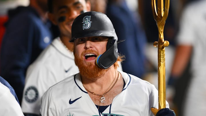 Sep 12, 2024; Seattle, Washington, USA; Seattle Mariners designated hitter Justin Turner (2) celebrates in the dugout after hitting a home run against the Texas Rangers during the fourth inning at T-Mobile Park.