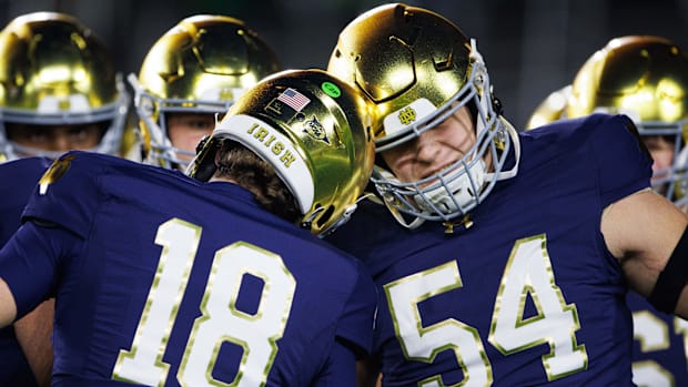 Anthonie Knapp peps up QB Steve Angeli during a 2024 game against Florida Stat