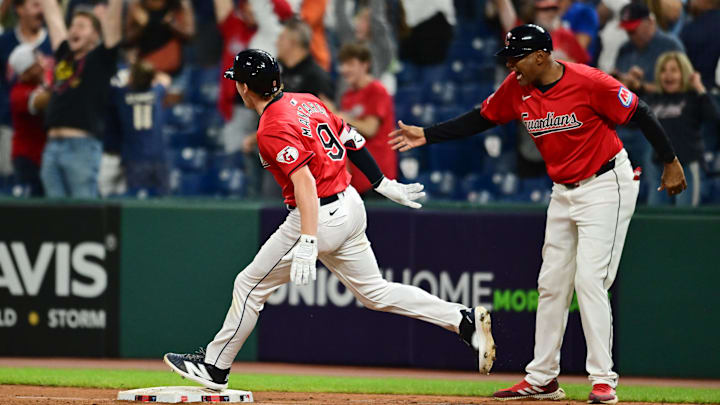 Sep 16, 2024; Cleveland, Ohio, USA; Cleveland Guardians designated hitter Kyle Manzardo (9) celebrates with first base coach Sandy Alomar Jr. (15)  after hitting a two-run home run during the eighth inning against the Minnesota Twins at Progressive Field. Mandatory Credit: Ken Blaze-Imagn Images