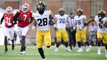 Nov 23, 2024; College Park, Maryland, USA;  Iowa Hawkeyes running back Kamari Moulton (28) runs for a touchdown during the second  half against the Maryland Terrapins at SECU Stadium. Mandatory Credit: Tommy Gilligan-Imagn Images