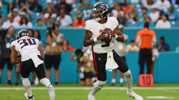 Aug 9, 2024; Miami Gardens, Florida, USA; Atlanta Falcons quarterback Michael Penix Jr. (9) looks for a passing option against the Miami Dolphins during the first quarter at Hard Rock Stadium. Mandatory Credit: Sam Navarro-USA TODAY Sports