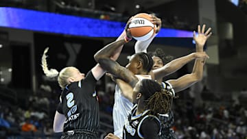 Jun 21, 2025; Chicago, Illinois, USA;  Phoenix Mercury forward Natasha Mack (4)  shoots against Chicago Sky guard Hailey Van Lith (2), guard Ariel Atkins (7) and  center Elizabeth Williams (1) during the first half at Wintrust Arena. Mandatory Credit: Matt Marton-Imagn Images