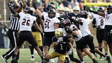 Northern Illinois linebacker Christian Fuhrman (44) intercepts a Notre Dame pass