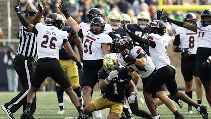 Northern Illinois linebacker Christian Fuhrman (44) intercepts a Notre Dame pass