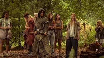 L-R: Silvana Estifanos as Teen Britt, Sophie Thatcher as Teen Natalie, Jenna Burgess as Teen Melissa, Jasmin Savoy Brown as Teen Taissa, Sophie Nélisse as Teen Shauna, Anisa Harris as Teen Robin, Liv Hewson as Teen Van, and Samantha Hanratty as Teen Misty in Yellowjackets season 3