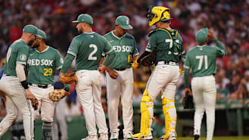 Jul 11, 2025; Boston, Massachusetts, USA; Boston Red Sox manager Alex Cora (13) relieves pitcher Jorge Alcala (71) in the third inning against the Tampa Bay Rays at Fenway Park. Mandatory Credit: David Butler II-Imagn Images