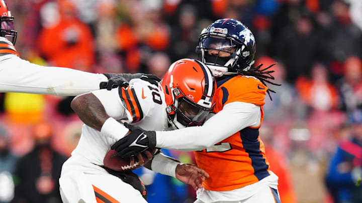Nov 26, 2023; Denver, Colorado, USA; Denver Broncos linebacker Nik Bonitto (42) sacks Cleveland Browns quarterback PJ Walker (10) in the second half at Empower Field at Mile High. Mandatory Credit: Ron Chenoy-Imagn Images