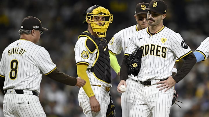 Oct 9, 2024; San Diego, California, USA; San Diego Padres manager Mike Shildt (8) takes out pitcher Dylan Cease (84) in the second inning against the Los Angeles Dodgers during game four of the NLDS for the 2024 MLB Playoffs at Petco Park.  Mandatory Credit: Denis Poroy-Imagn Images