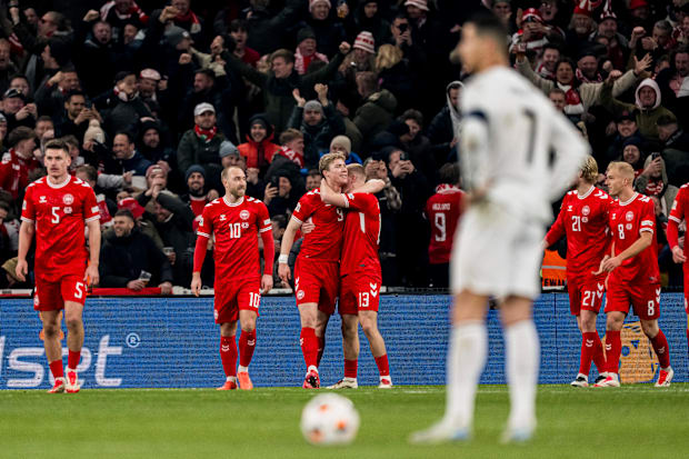 Denmark celebrate as Cristiano Ronaldo watches o