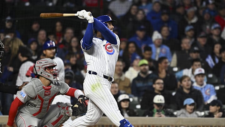 Apr 20, 2026; Chicago, Illinois, USA;  Chicago Cubs left fielder Michael Conforto (20) hits a RBI sacrifice fly ball against the Philadelphia Phillies during the third inning at Wrigley Field. Mandatory Credit: Matt Marton-Imagn Images