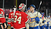 Dec 31, 2024; Chicago, Illinois, USA; Chicago Blackhawks goaltender Petr Mrazek (34) and St. Louis Blues center Brayden Schenn (10) shake hands after the Winter Classic at Wrigley Field. Mandatory Credit: Daniel Bartel-Imagn Images