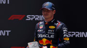 May 4, 2024; Miami Gardens, Florida, USA; Red Bull Racing driver Max Verstappen (1) poses with first place trophy the after winning the F1 Sprint Race at Miami International Autodrome. Mandatory Credit: Peter Casey-USA TODAY Sports