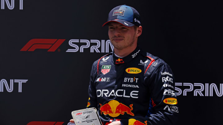 May 4, 2024; Miami Gardens, Florida, USA; Red Bull Racing driver Max Verstappen (1) poses with first place trophy the after winning the F1 Sprint Race at Miami International Autodrome. Mandatory Credit: Peter Casey-USA TODAY Sports