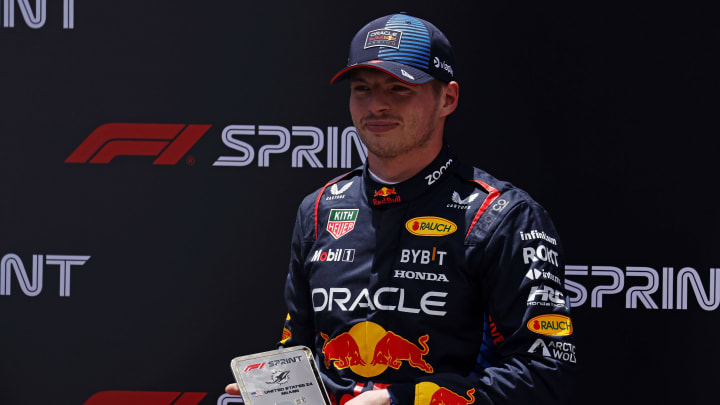 May 4, 2024; Miami Gardens, Florida, USA; Red Bull Racing driver Max Verstappen (1) poses with first place trophy the after winning the F1 Sprint Race at Miami International Autodrome. Mandatory Credit: Peter Casey-USA TODAY Sports