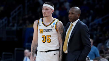 Mar 20, 2025; Wichita, KS, USA; Missouri Tigers guard Jacob Crews (35) talks to head coach Dennis Gates in the second half of a first round men’s NCAA Tournament game against the Drake Bulldogs at Intrust Bank Arena. Mandatory Credit: Kirby Lee-Imagn Images