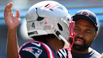 Sep 15, 2024; Foxborough, Massachusetts, USA; New England Patriots head coach Jerod Mayo talks with running back Antonio Gibson (4) before a game against the Seattle Seahawks at Gillette Stadium. Mandatory Credit: Brian Fluharty-Imagn Images