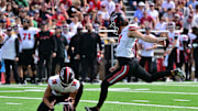 Sep 28, 2024; Chestnut Hill, Massachusetts, USA; Western Kentucky Hilltoppers place kicker Lucas Carneiro (17) kicks an extra point against the Boston College Eagles during the first half at Alumni Stadium. Mandatory Credit: Eric Canha-Imagn Images