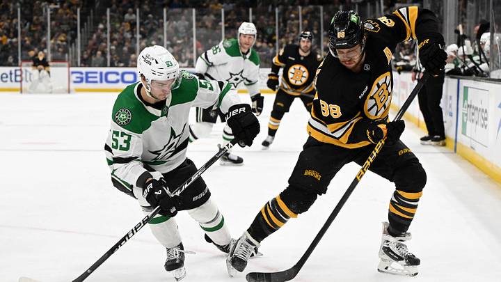 Mar 31, 2026; Boston, Massachusetts, USA; Boston Bruins right wing David Pastrnak (88) controls the puck against Dallas Stars center Wyatt Johnston (53) during the first period at the TD Garden. Mandatory Credit: Brian Fluharty-Imagn Images