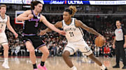 Dec 3, 2025; Chicago, Illinois, USA;  Brooklyn Nets forward Noah Clowney (21) dribbles against Chicago Bulls guard Josh Giddey (3) during the second half at the United Center. Mandatory Credit: Matt Marton-Imagn Images