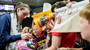 Indiana Fever guard Caitlin Clark (22) signs autographs for fans after the Fever defeated Brazil in a preseason game May 4, 2025 at Carver-Hawkeye Arena in Iowa City, Iowa.