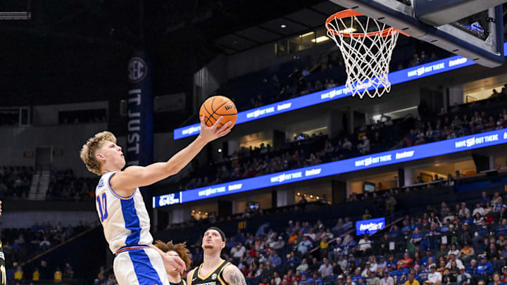 Mar 14, 2025; Nashville, TN, USA;  Florida Gators forward Thomas Haugh (10) lays the ball in against the Missouri Tigers during the first half at Bridgestone Arena. Mandatory Credit: Steve Roberts-Imagn Images