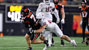 Nov 23, 2024; Corvallis, Oregon, USA; Oregon State Beavers wide receiver Trent Walker (7) catches a pass and is tackled by Washington State Cougars edge Isaac Terrell (88) during the fourth quarter at Reser Stadium. Mandatory Credit: Craig Strobeck-Imagn Images