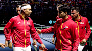 Rafael Nadal and Carlos Alcaraz talk on the court at the Davis Cup.