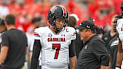Spencer Rattler and Dowell Loggains before South Carolina's 24–14 loss to No. 1 Georgia on Sept. 16, 2023.
