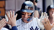 New York Yankees star Aaron Judge celebrates hitting a record-breaking home run.