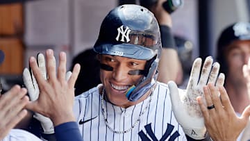 New York Yankees star Aaron Judge celebrates hitting a record-breaking home run.