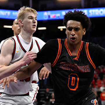 Alijah Arenas drives to the hoop during a state championship.
