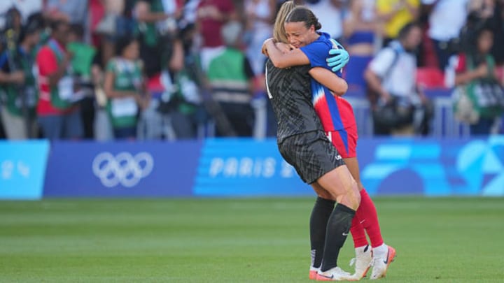 Alyssa Naeher and Mallory Swanson of the United States hug after defeating Brazil after the women's gold medal match.