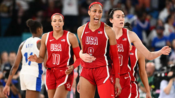 Napheesa Collier, A'ja Wilson and Breanna Stewart react after a basket in the women's gold medal basketball game in Paris.